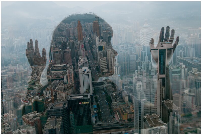 cityscape with hand silhouette