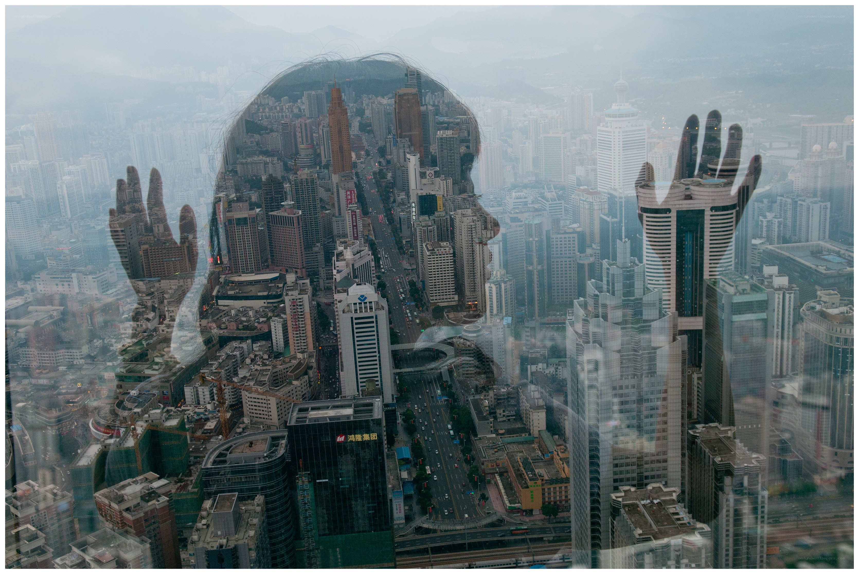 cityscape with hand silhouette