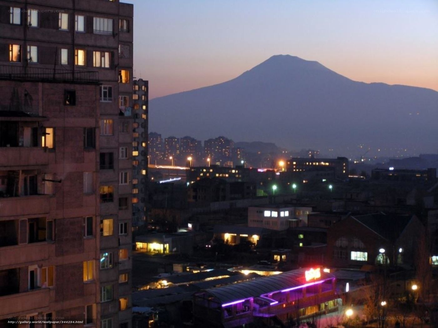 Cityscape with mountain at dusk