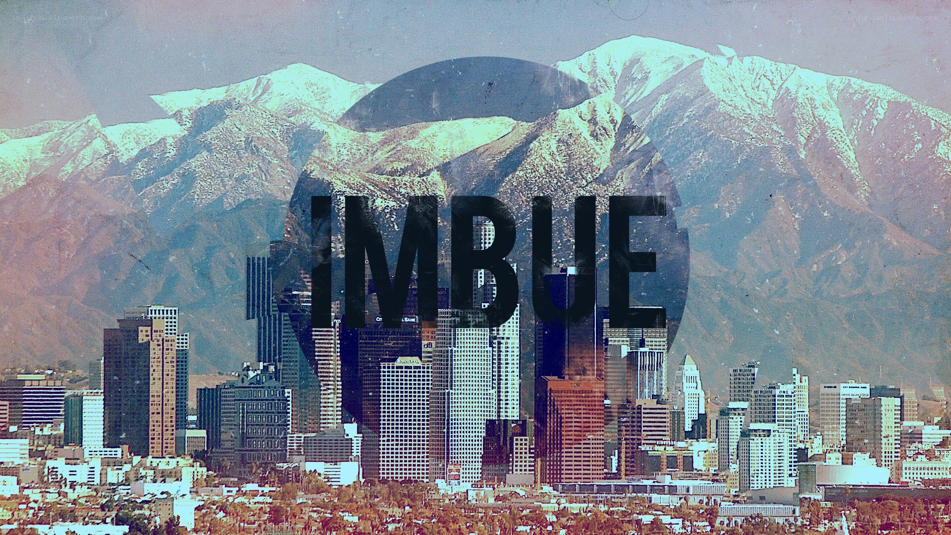cityscape with mountains and text overlay