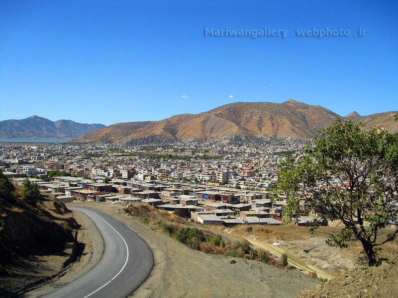 Cityscape with Mountains — Blue, Serene, Afternoon, Photograph, Road