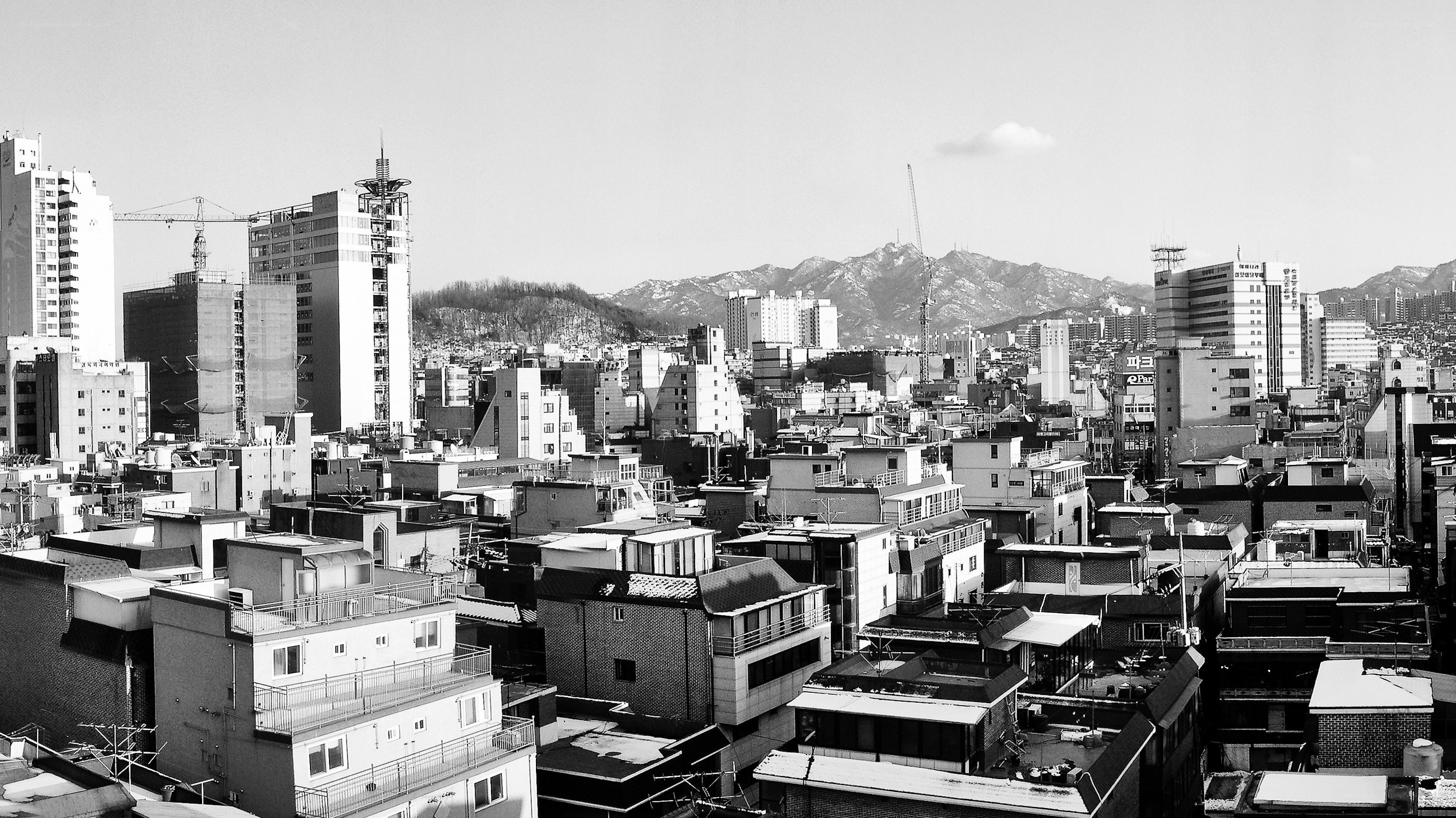 cityscape with mountains in background