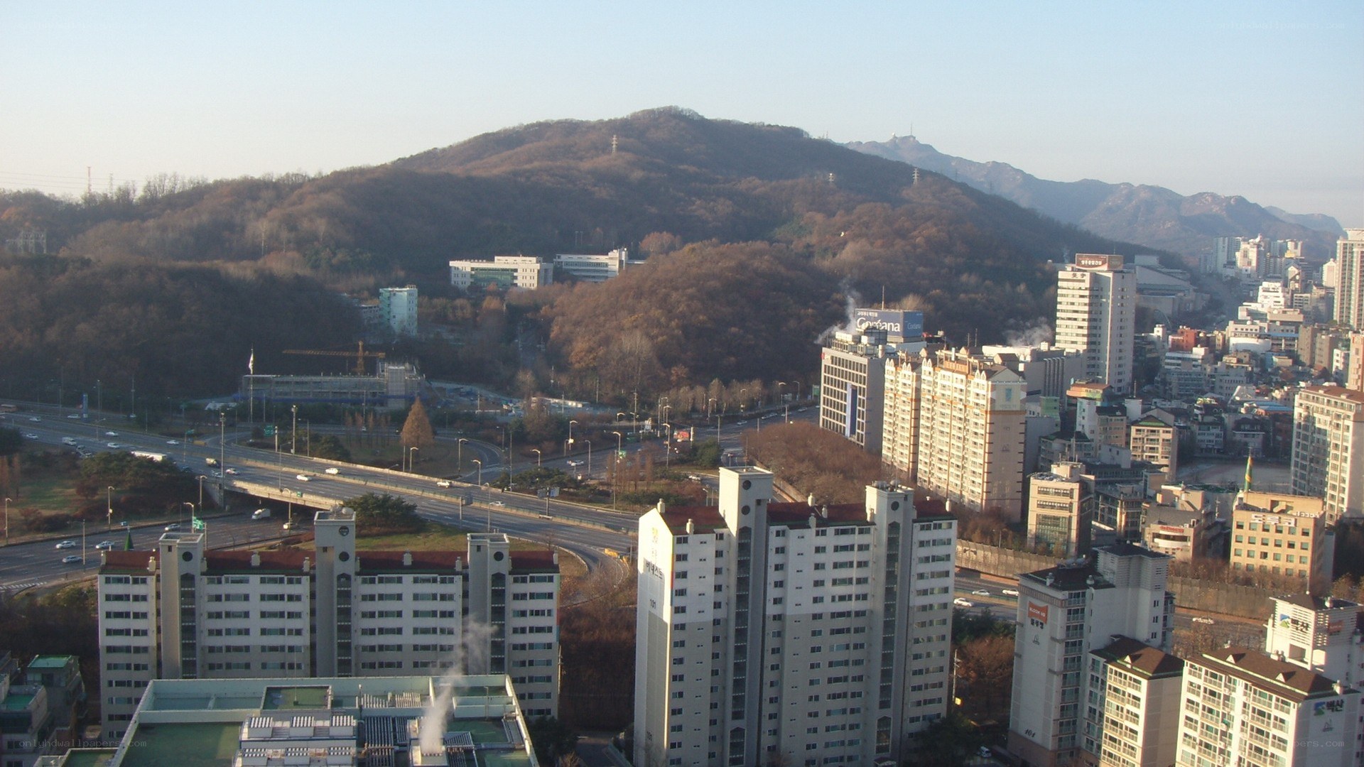 cityscape with mountains in background