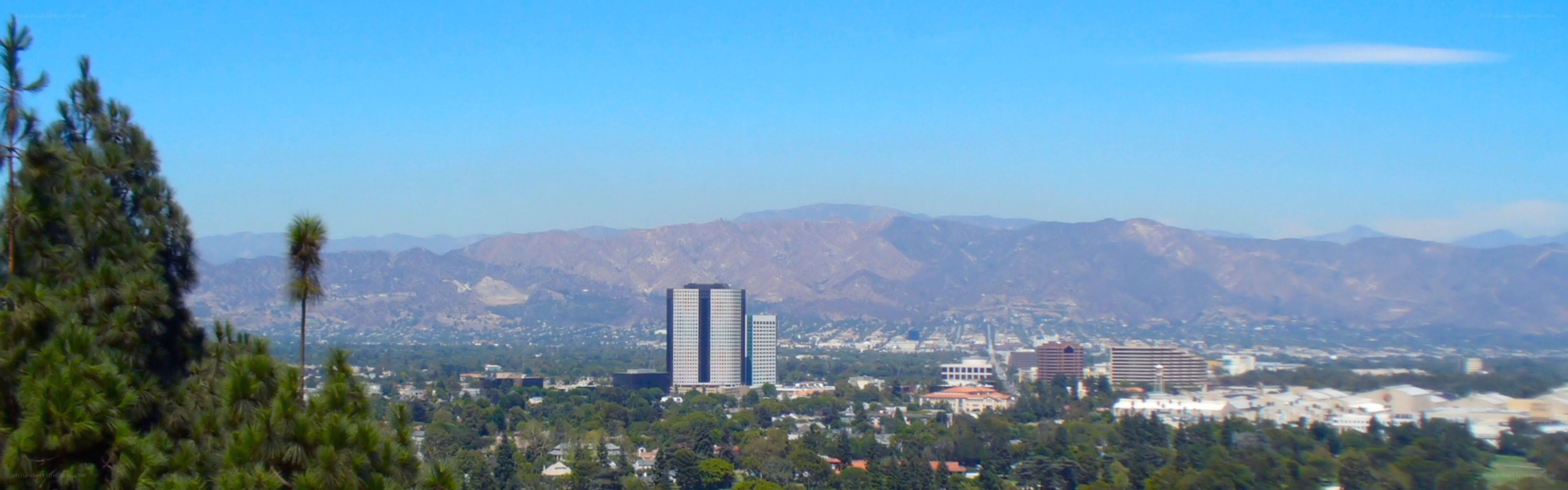 cityscape with mountains in background