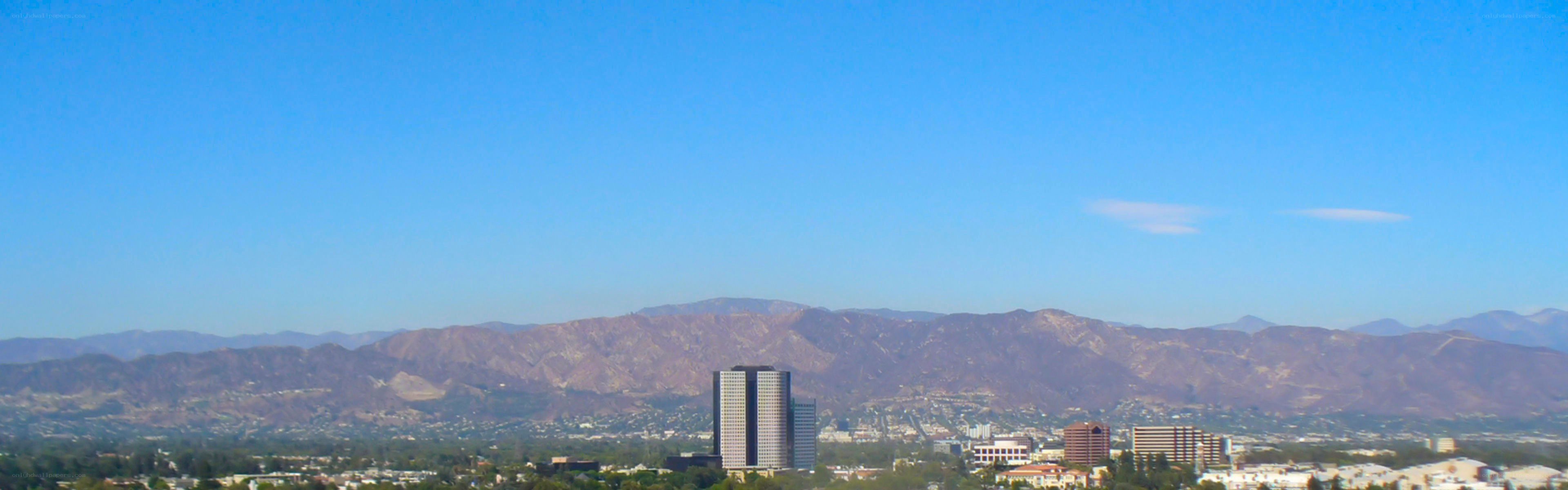 cityscape with mountains in background