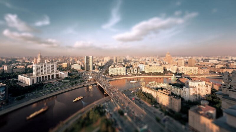 Cityscape with River and Bridge — Blue, Serene, Afternoon, Photograph, Buildings