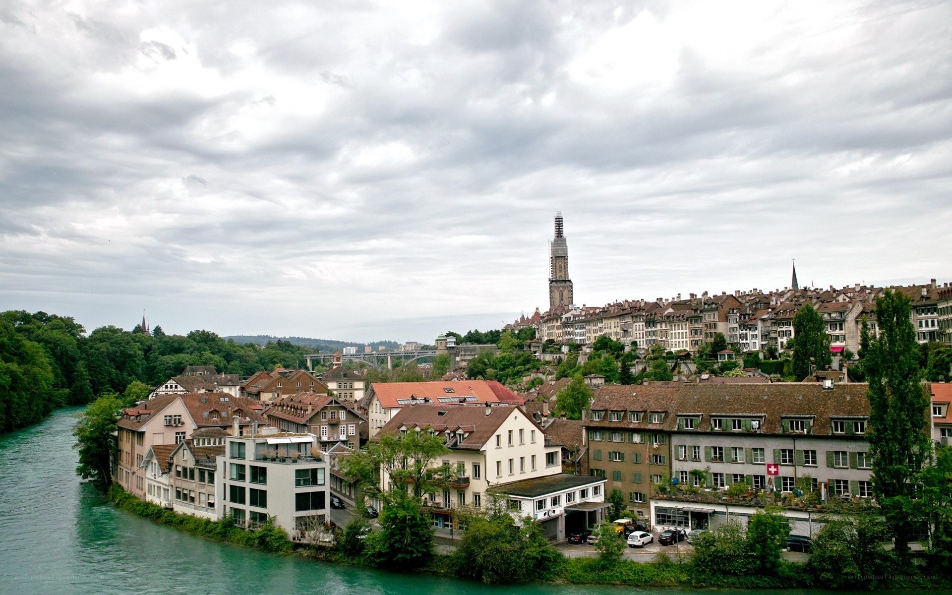 cityscape with river and church tower