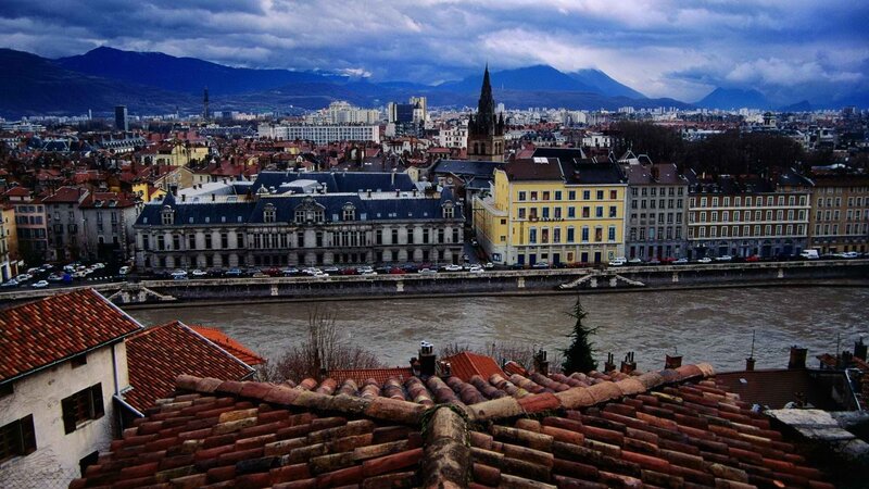 Cityscape with river and mountains