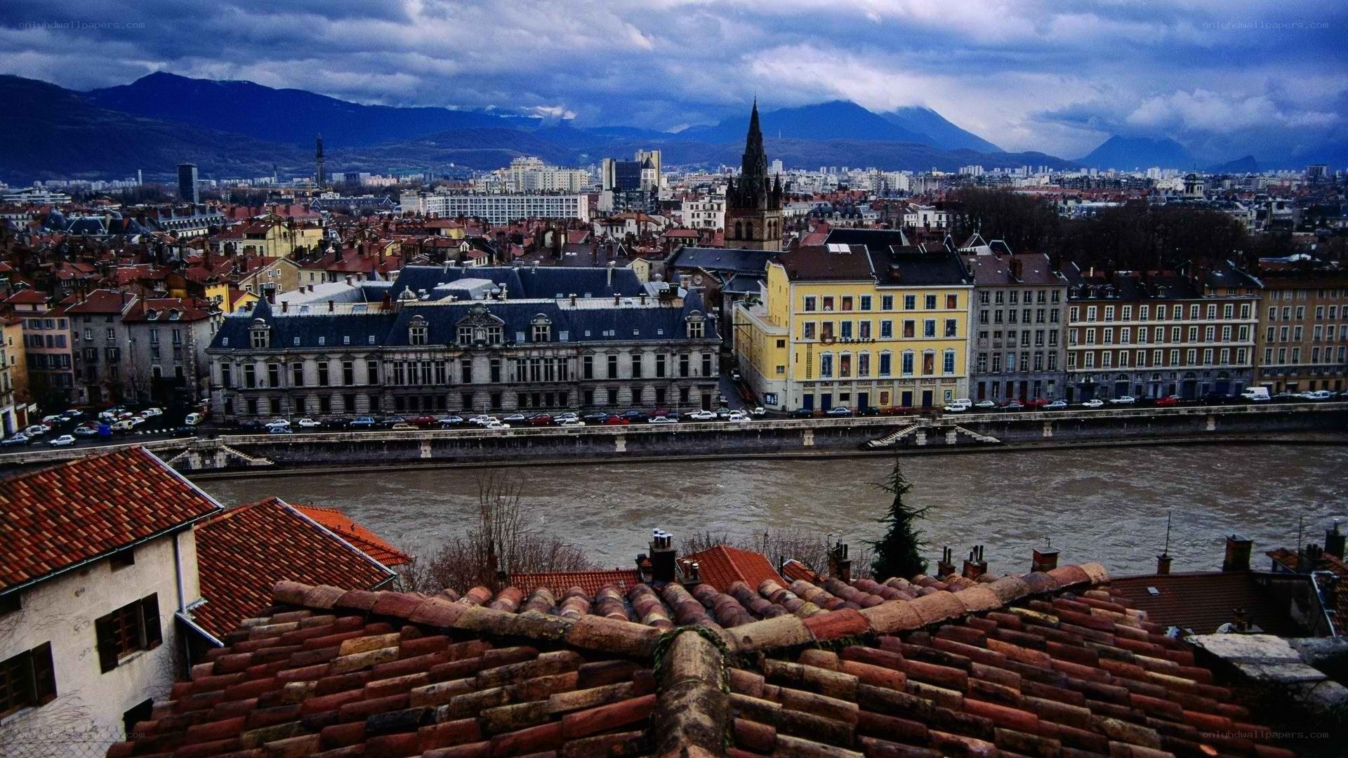 Cityscape with river and mountains