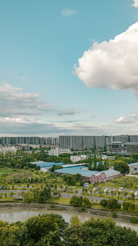 Cityscape with River — Blue, Serene, Afternoon, Photograph