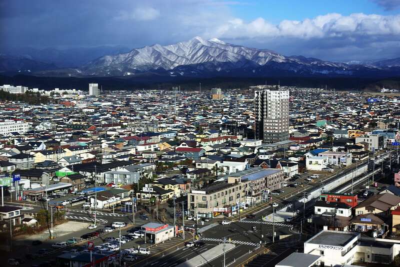 Cityscape with Snow-capped Mountains — Blue