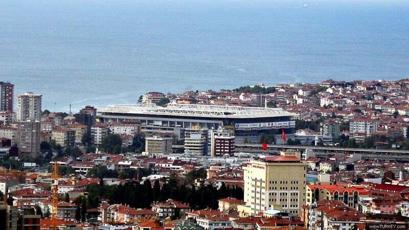 cityscape with stadium and sea