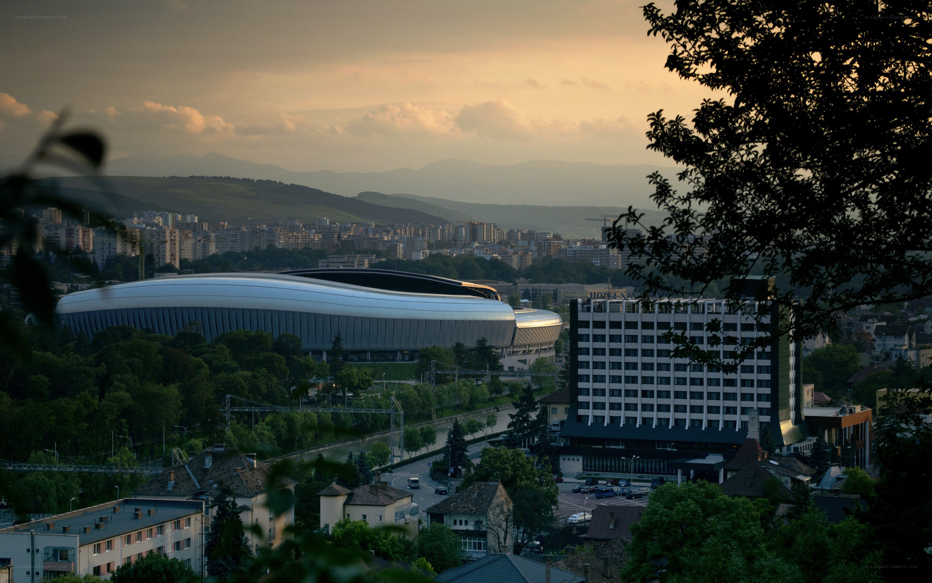 Cityscape with stadium at dusk