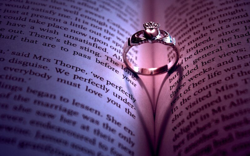 Claddagh ring on open book
