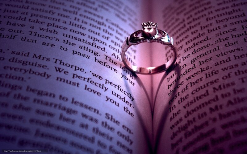 Claddagh ring on open book