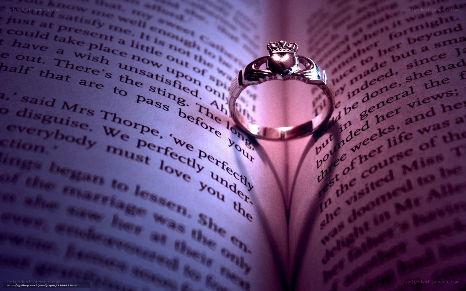 Claddagh ring on open book