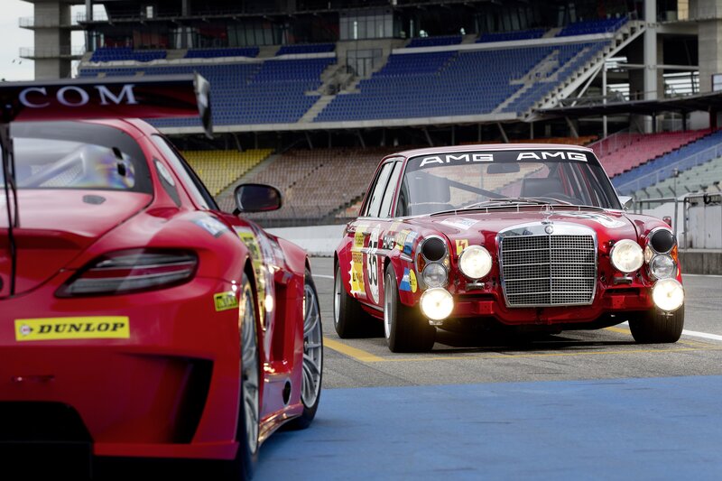 Classic and modern race cars on track