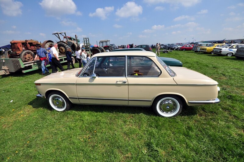 Classic beige BMW at car show