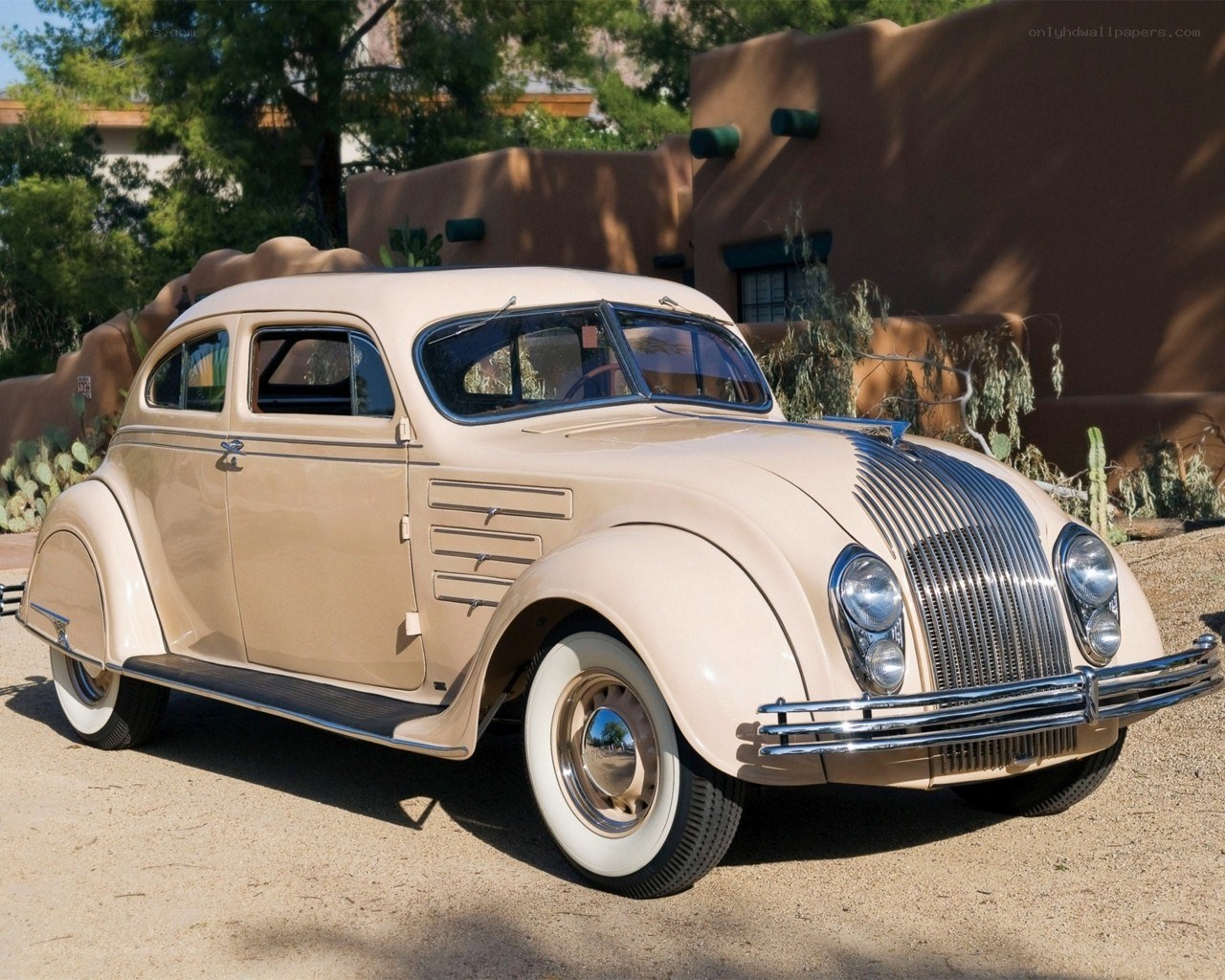 Classic beige car in desert setting