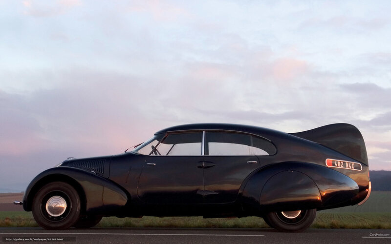 Classic black car at sunset