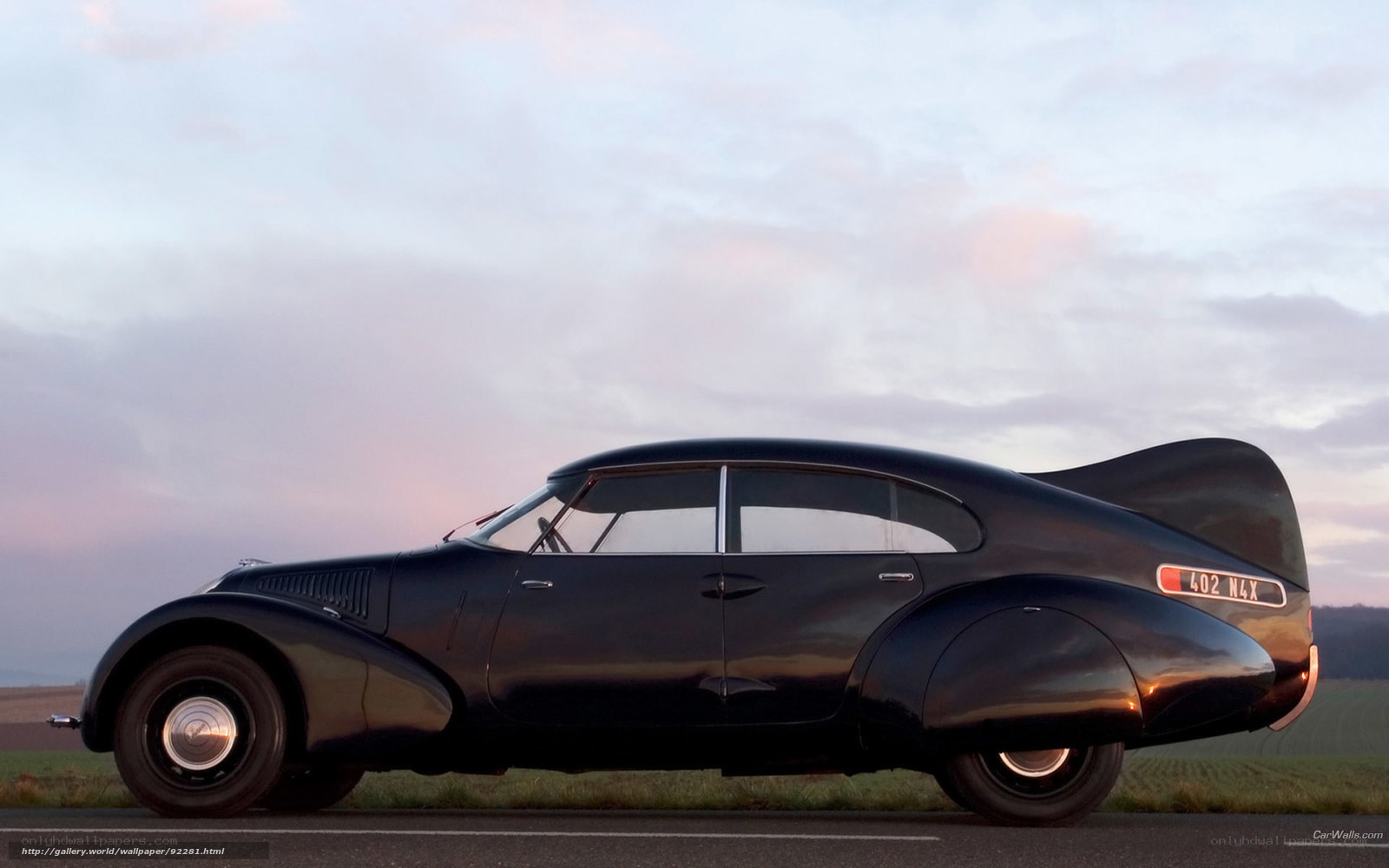Classic black car at sunset