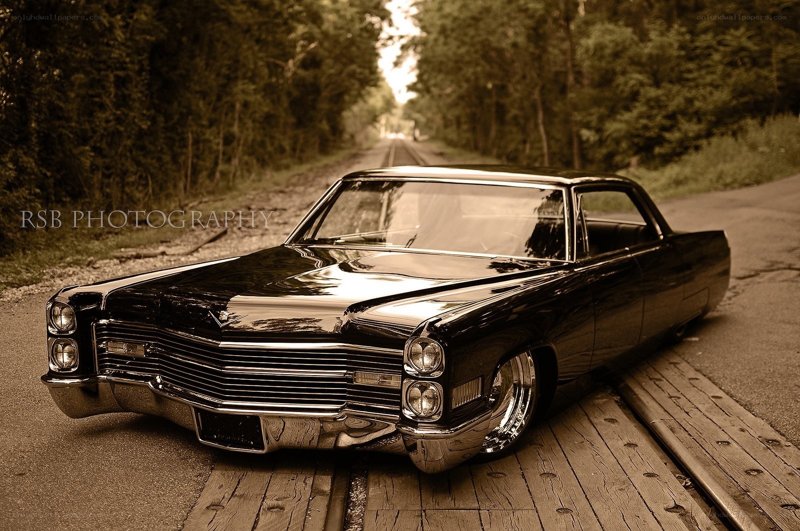 Classic black car on a forest road