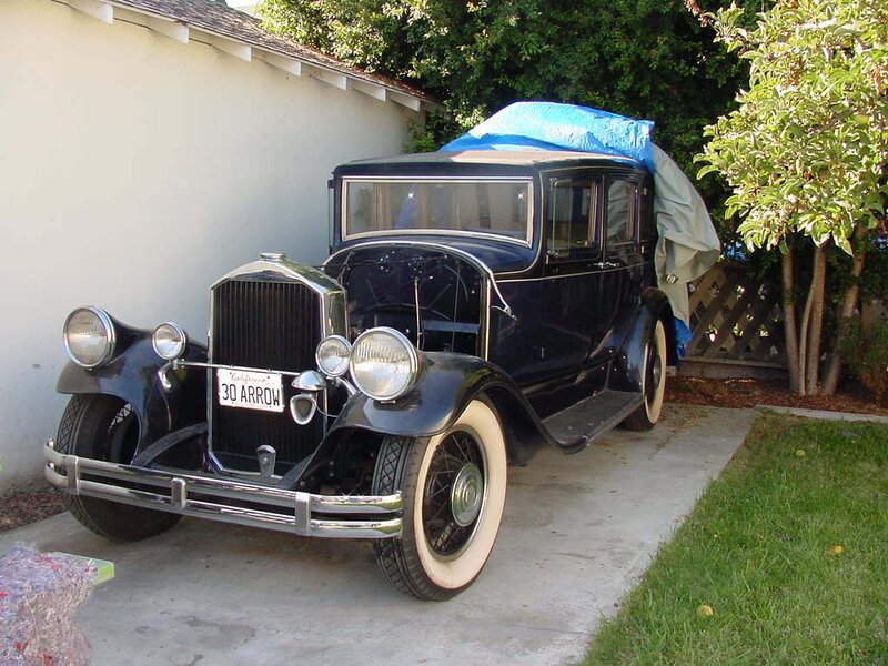 Classic black car with white-walled tires