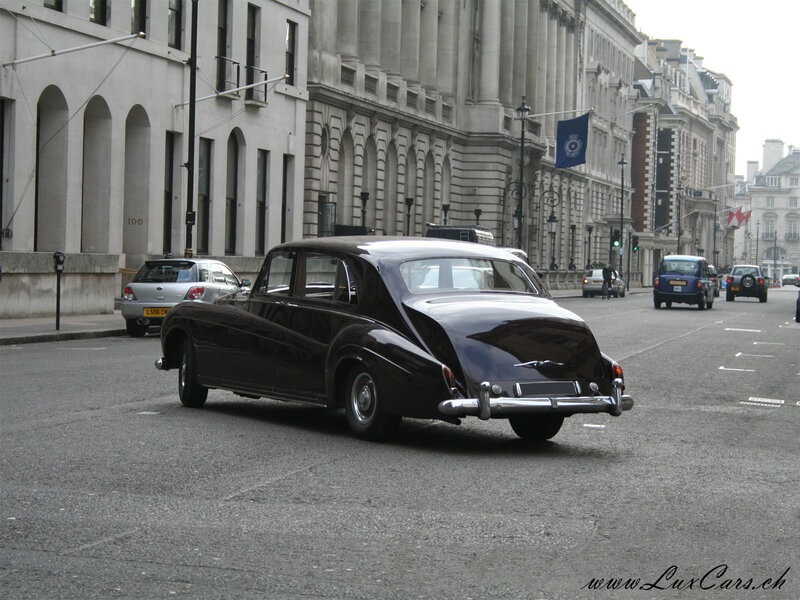 Classic black limousine on city street