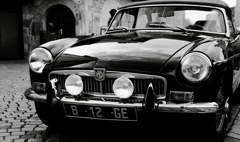 Classic black MG car on cobblestones