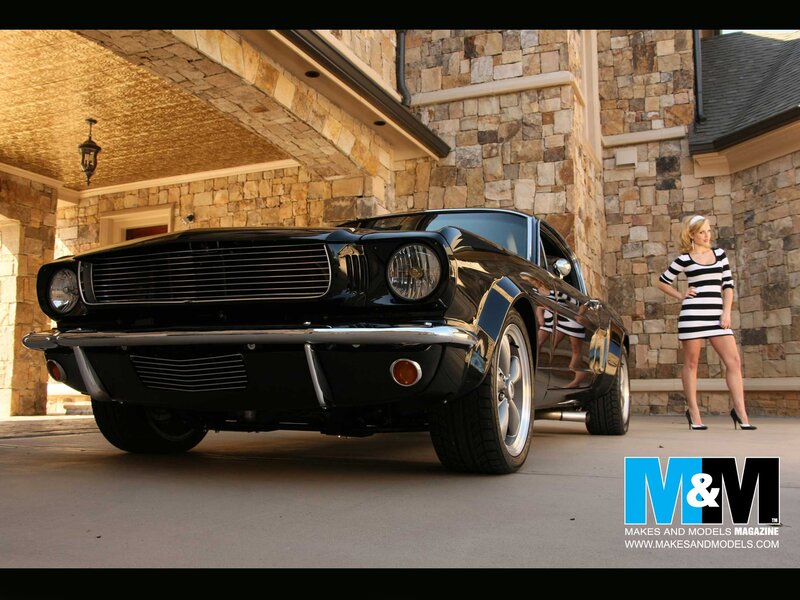 Classic black Mustang with woman