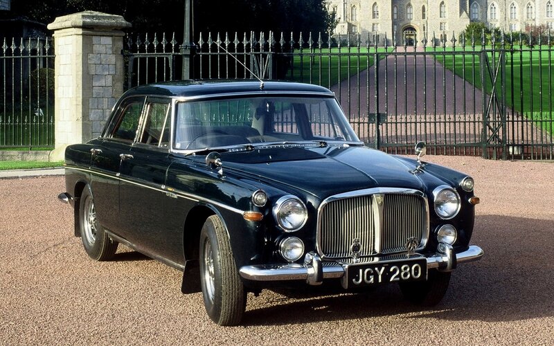 Classic black sedan at a palace