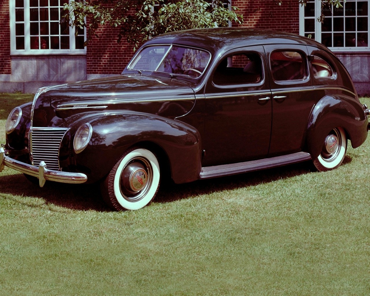 Classic black sedan on grass