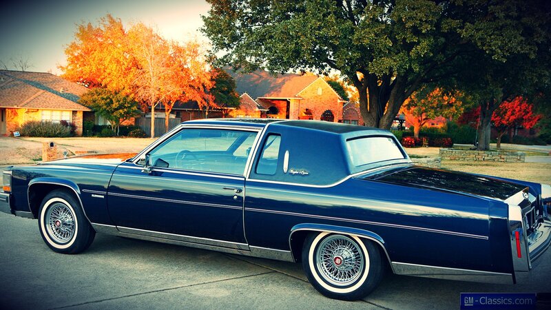 Classic blue Cadillac parked on street