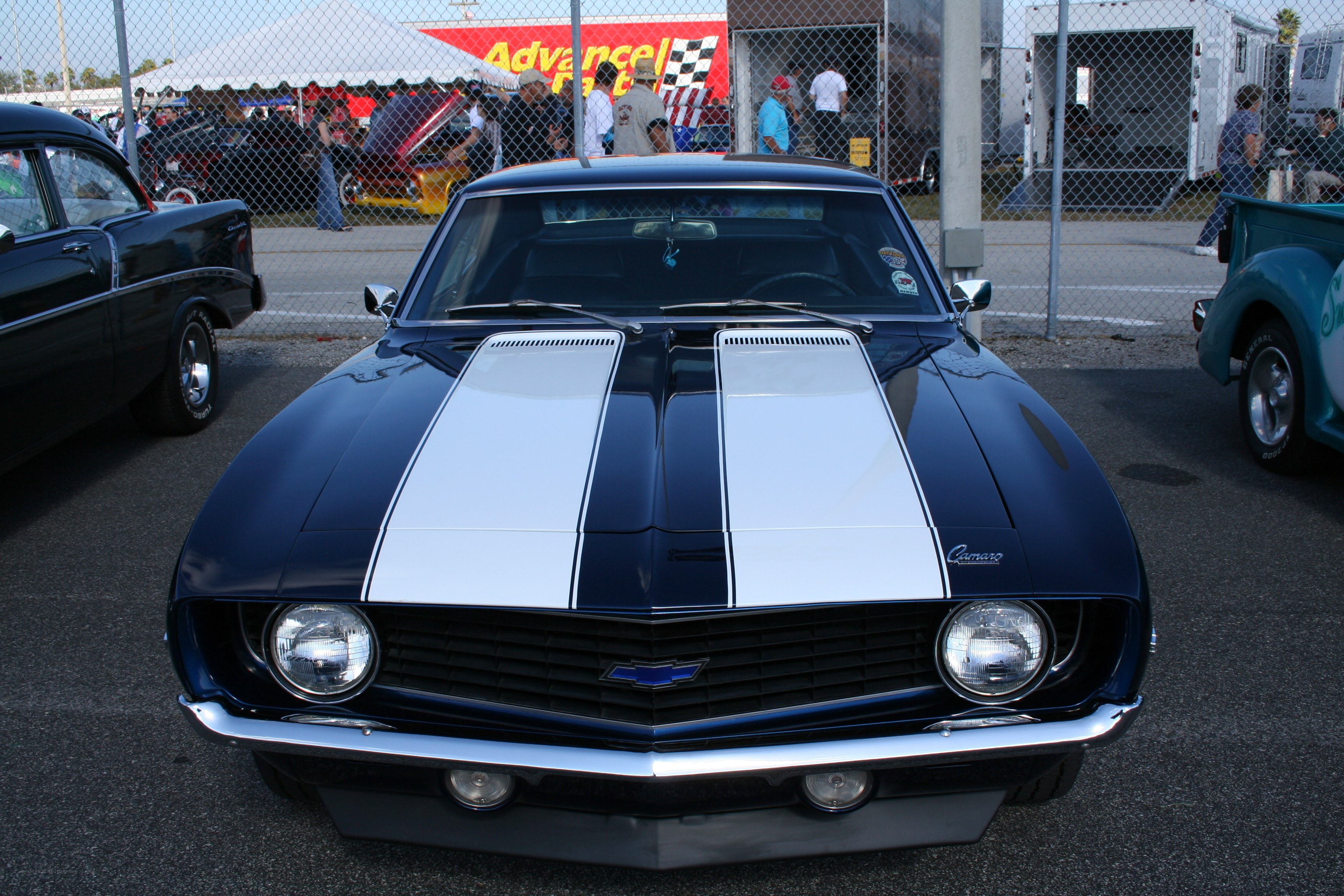 Classic blue Camaro with white stripes
