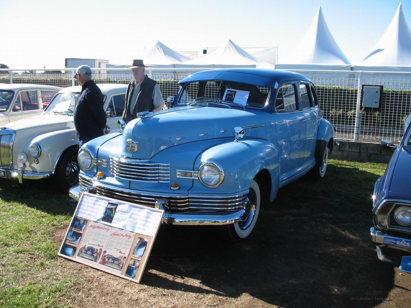 Classic blue car at a show