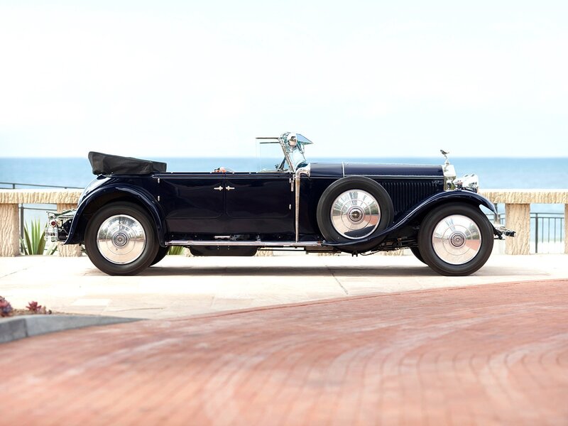 Classic blue convertible by the sea