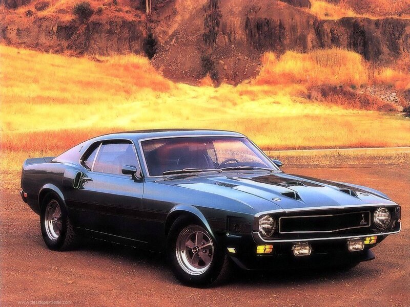 Classic blue muscle car on dirt road