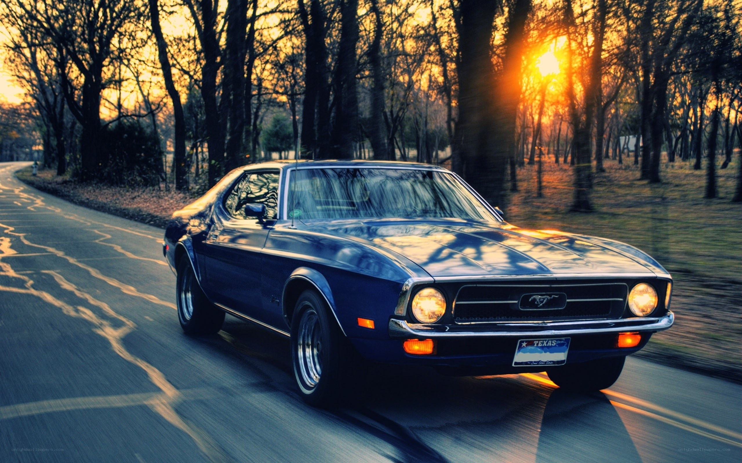 Classic blue Mustang at sunset