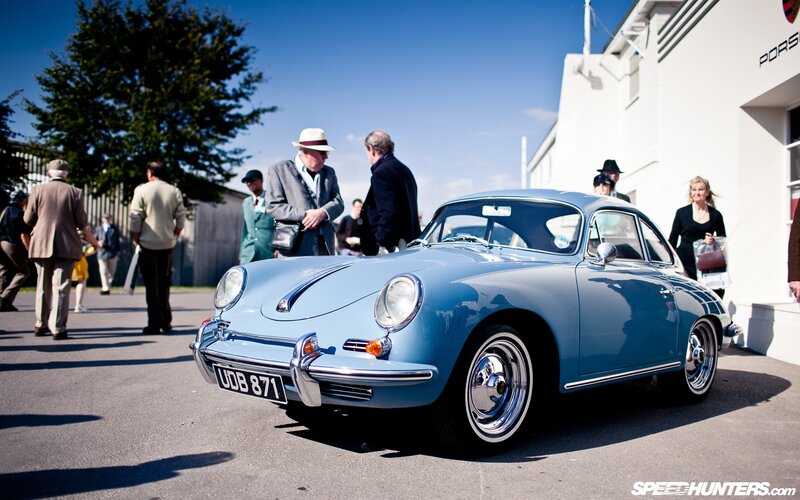 Classic blue Porsche at a car show