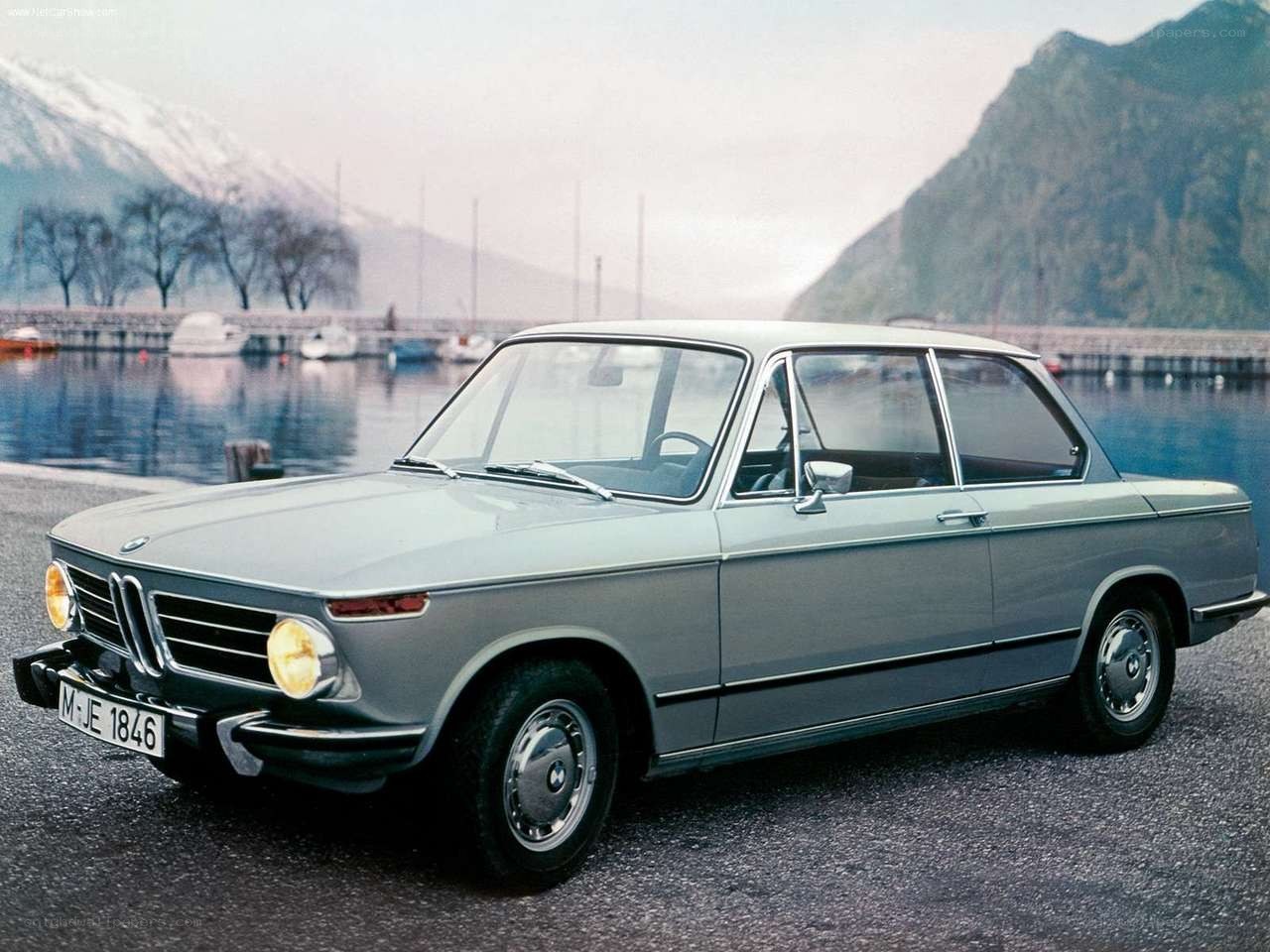 Classic BMW 2002 parked by a lake