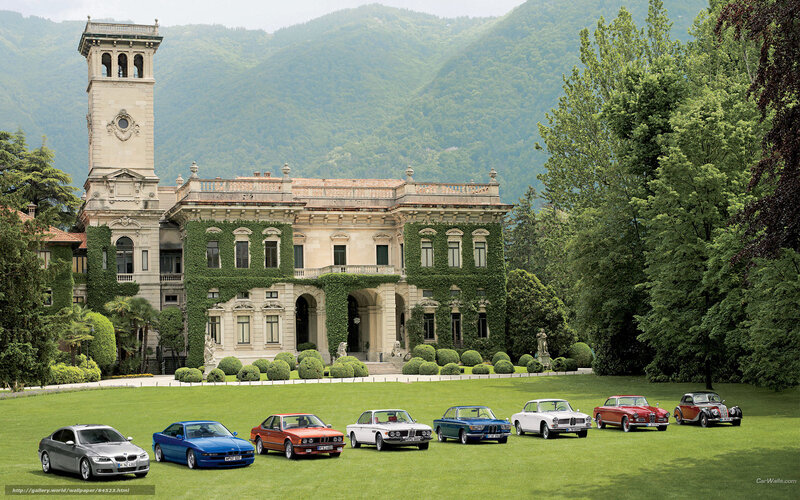 Classic BMW cars at a villa
