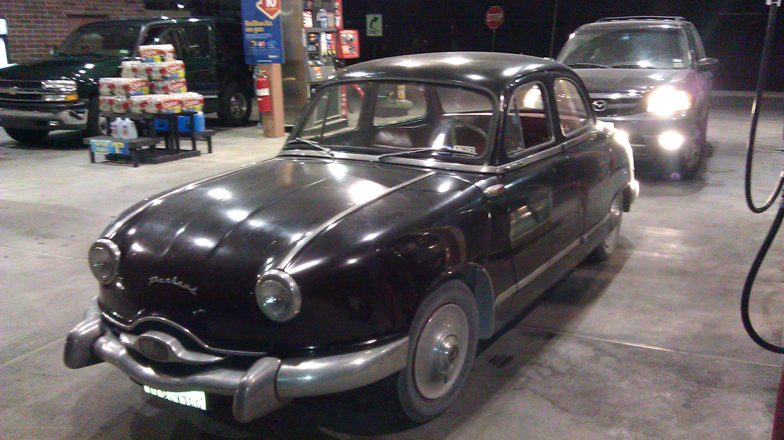 Classic car at a gas station