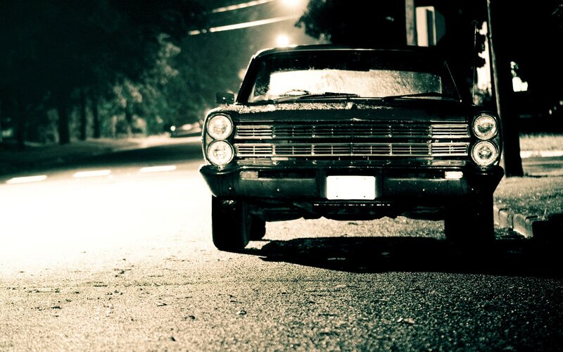 classic car at night on street