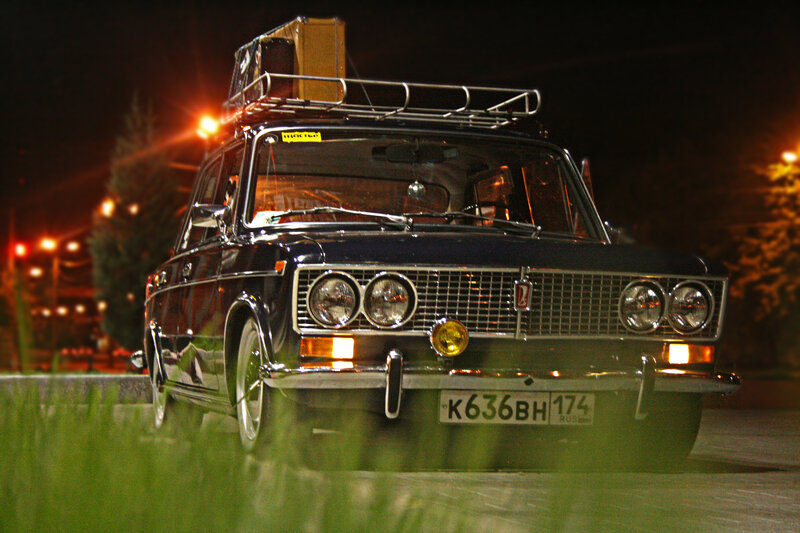 Classic car at night with luggage