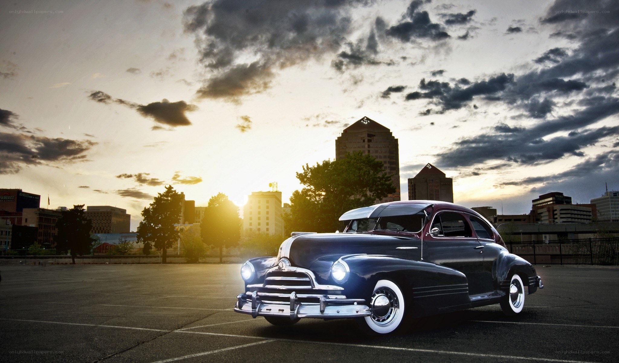 Classic car at sunset in city