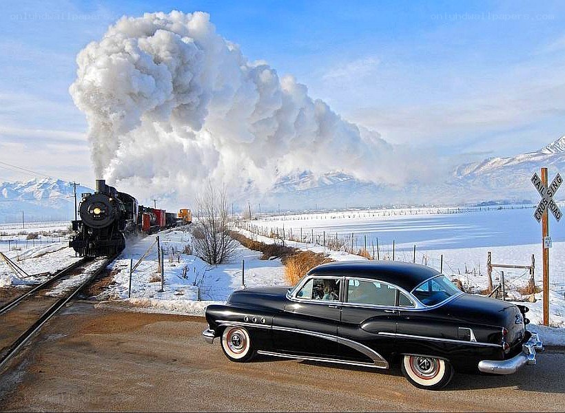 classic car at train crossing