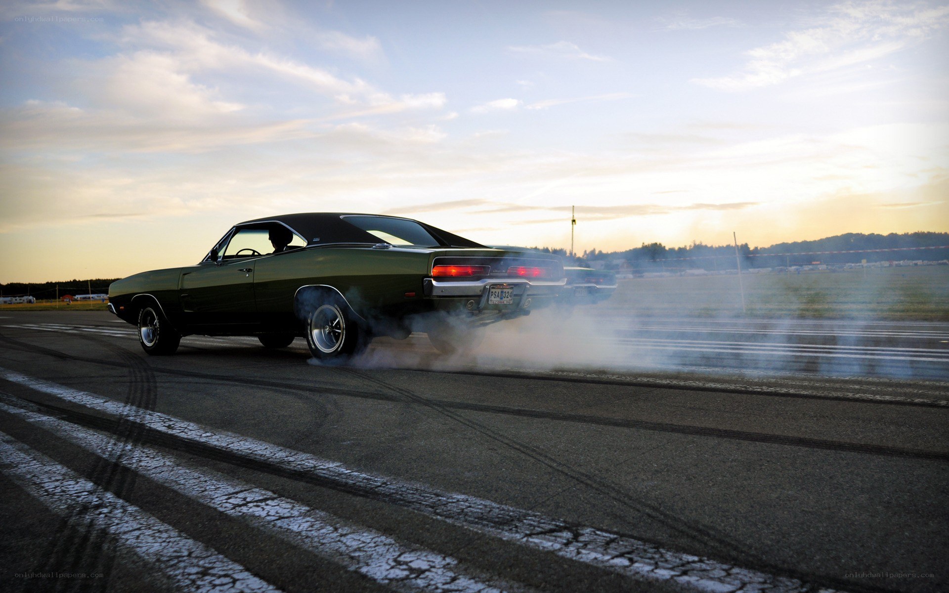 Classic car burnout on track