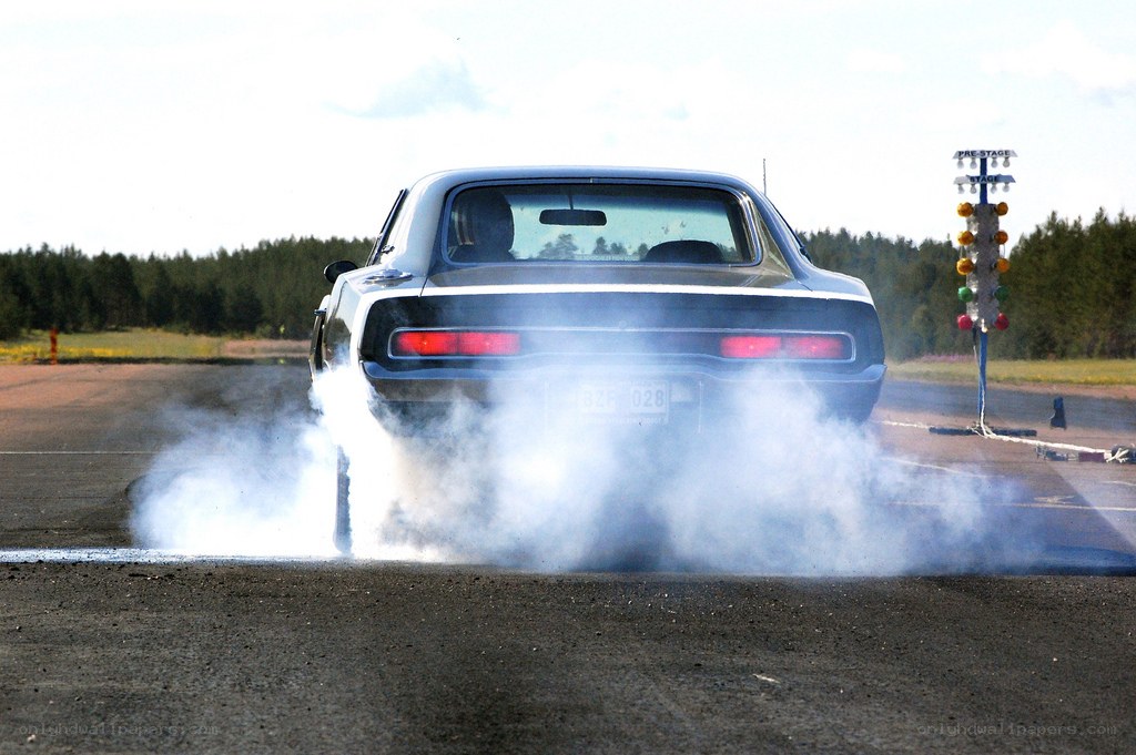 Classic car burnout on track