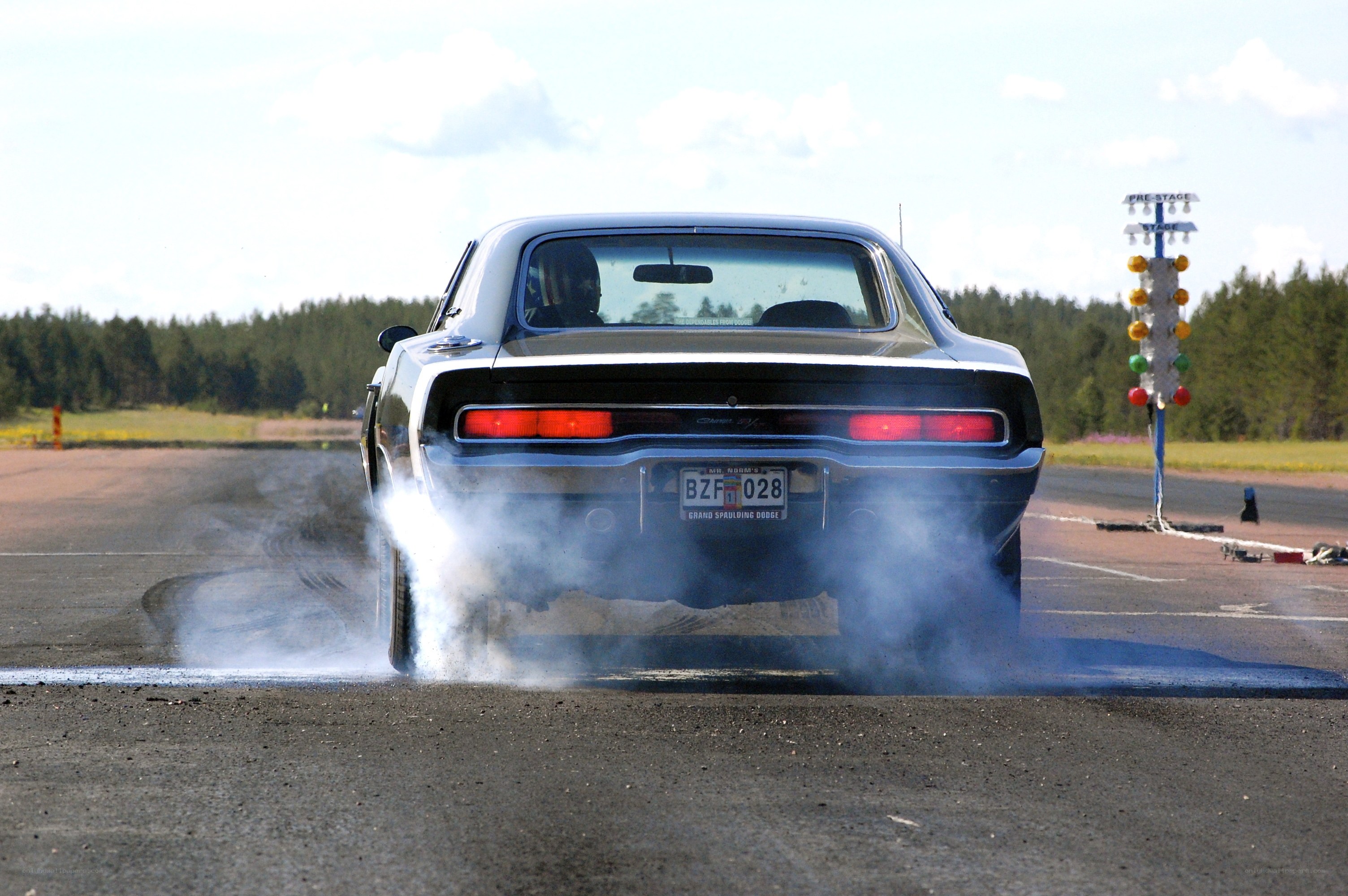 Classic car burnout on track