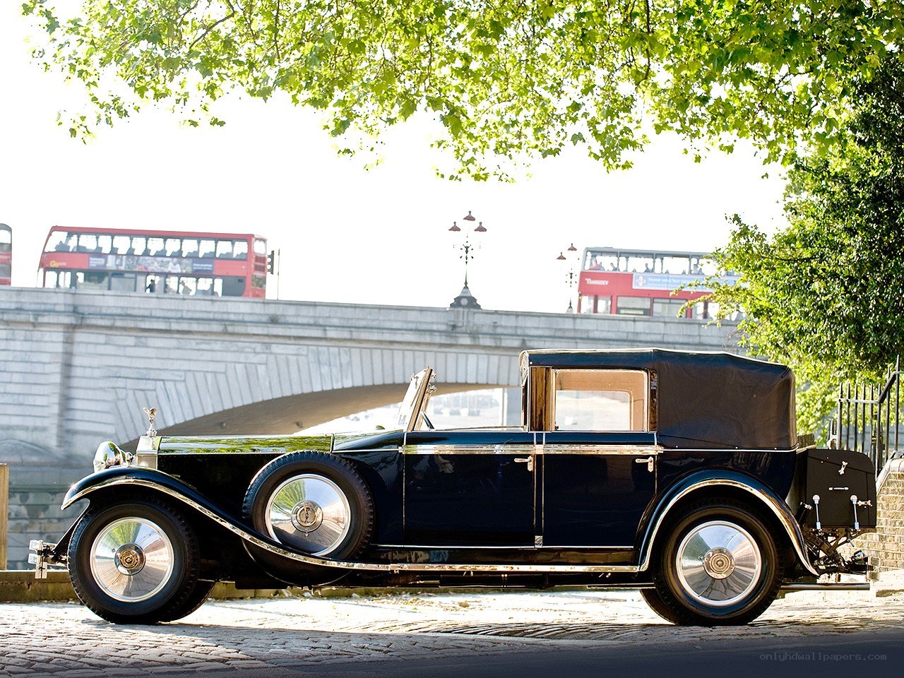 Classic car by a bridge